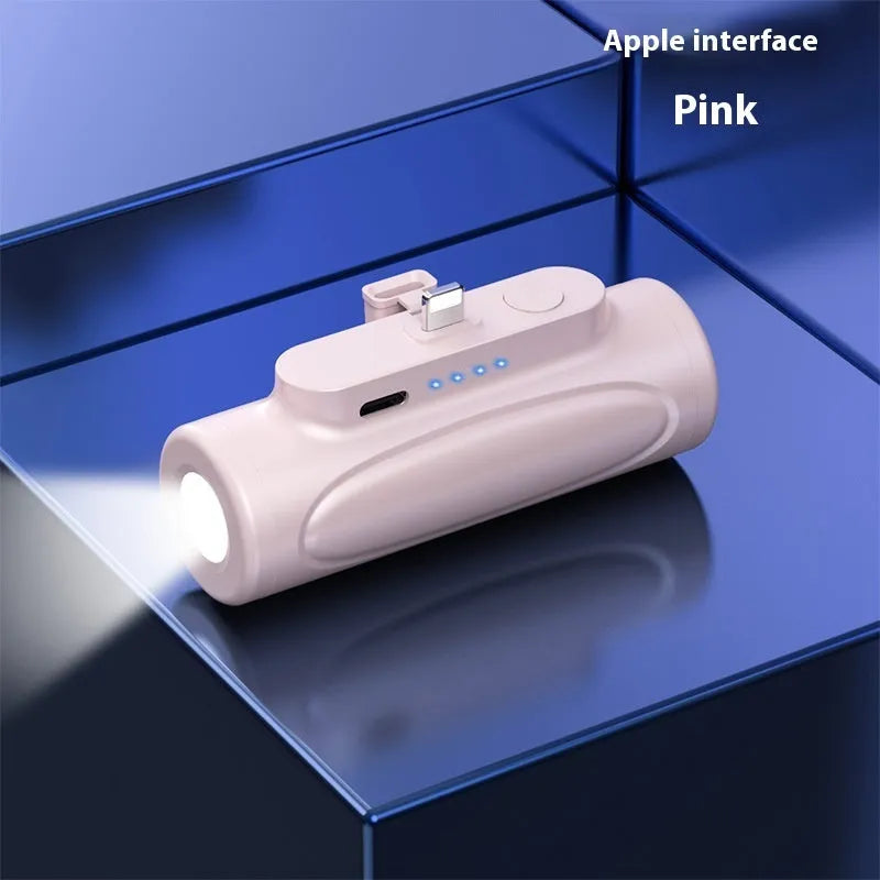 Black and pink creative power bank with integrated LED flashlight, showing Type-C and Apple port options, 83mm long.