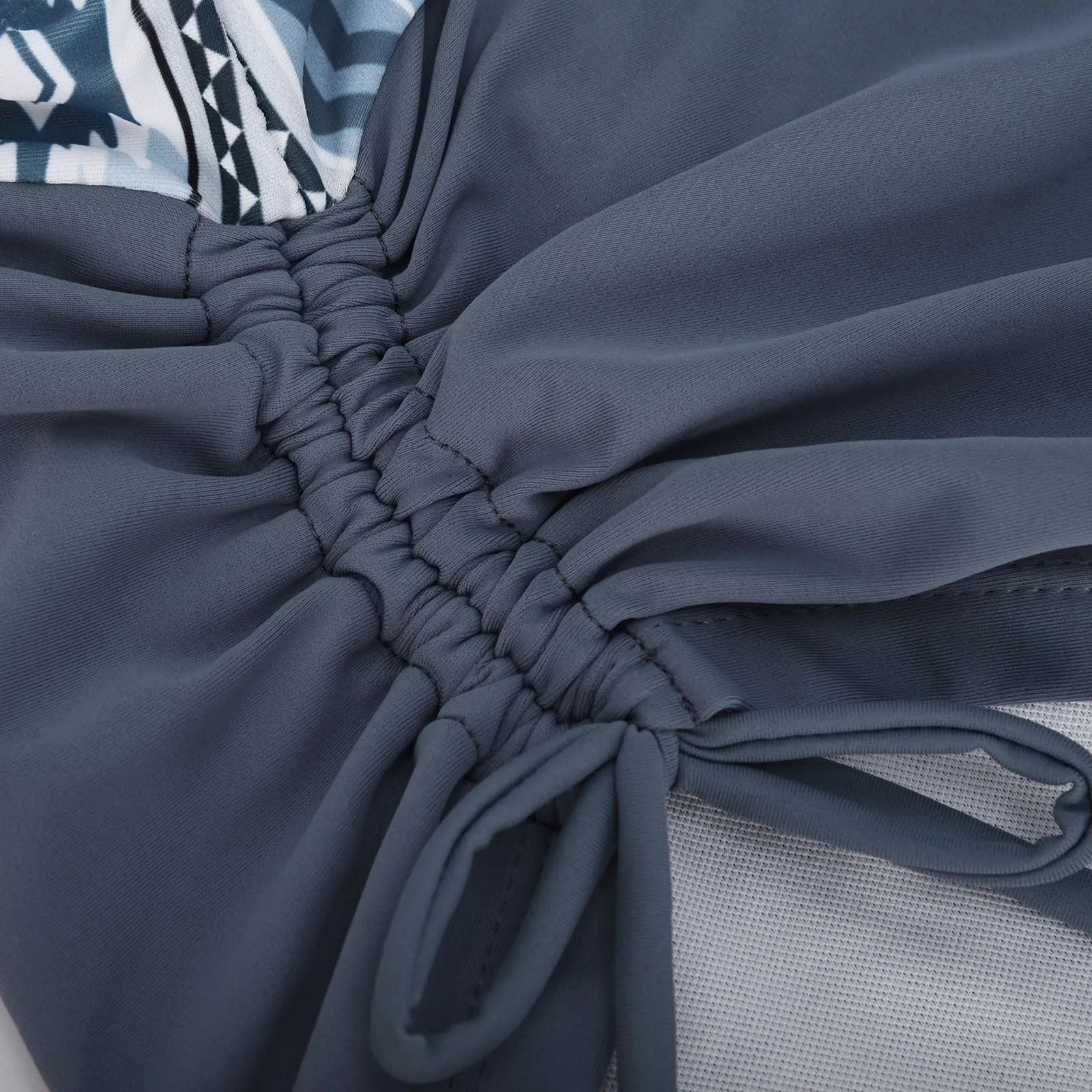 Women's split front bikini swimsuit in picture colour, showing triangle top and high-rise briefs.