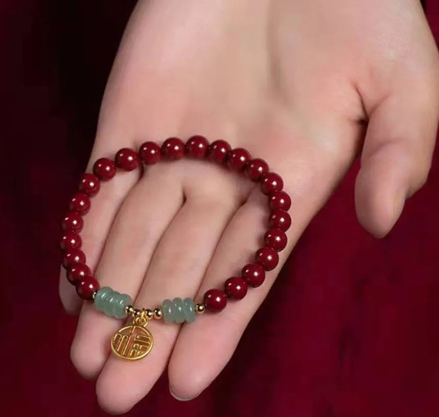 Handmade wave-shaped bracelet with alternating cinnabar and copper beads.