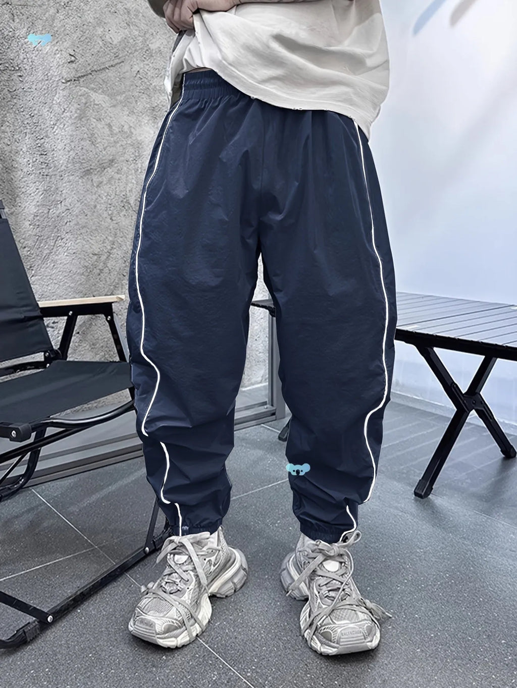 Men's loose-fit cropped casual trousers in bamboo fabric, shown in Army Green colour.