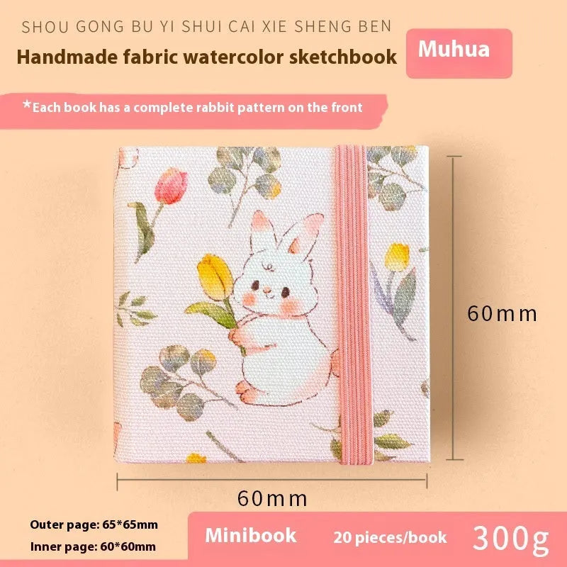 Feiluniao handmade fabric watercolour sketchbook with colourful themed cover, 185mm long.