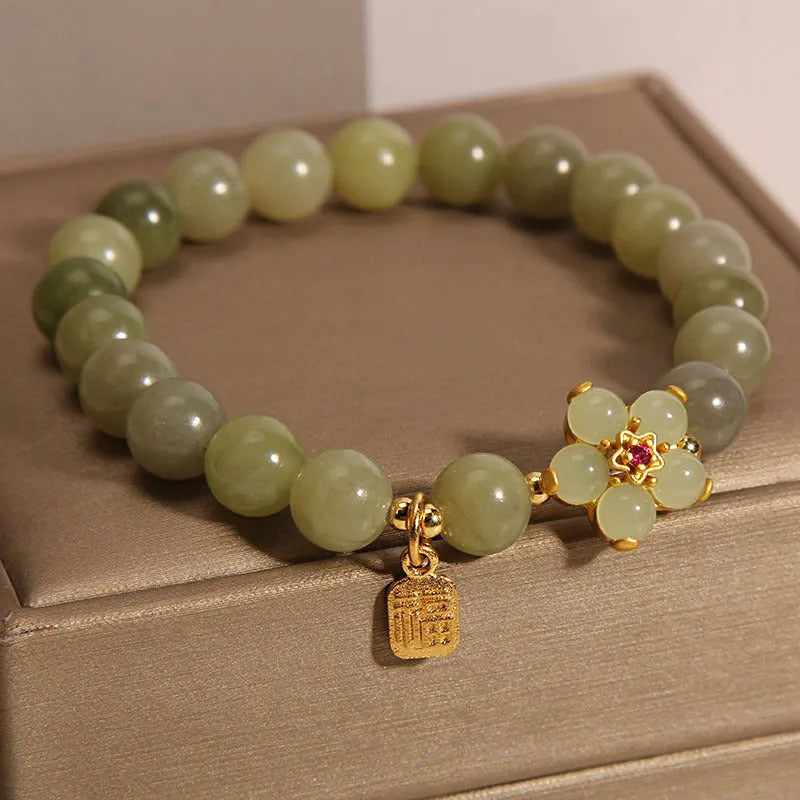Women's casual alloy bracelet with grey jade stone accent on wrist