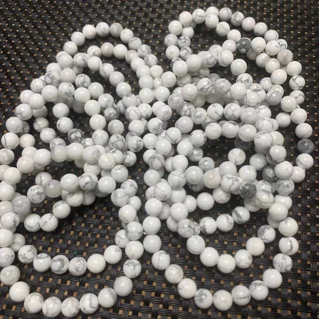 Natural white turquoise single circle bracelet with 8mm beads on a white background