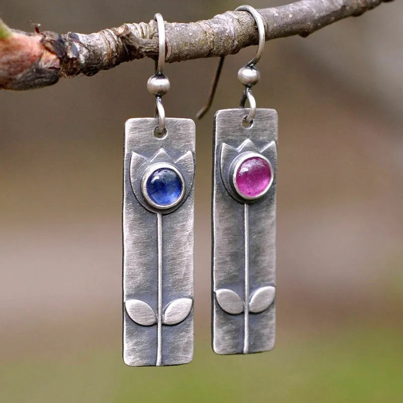 Antique finish red sapphire earrings with geometric ellipse shapes and electroplated metal construction