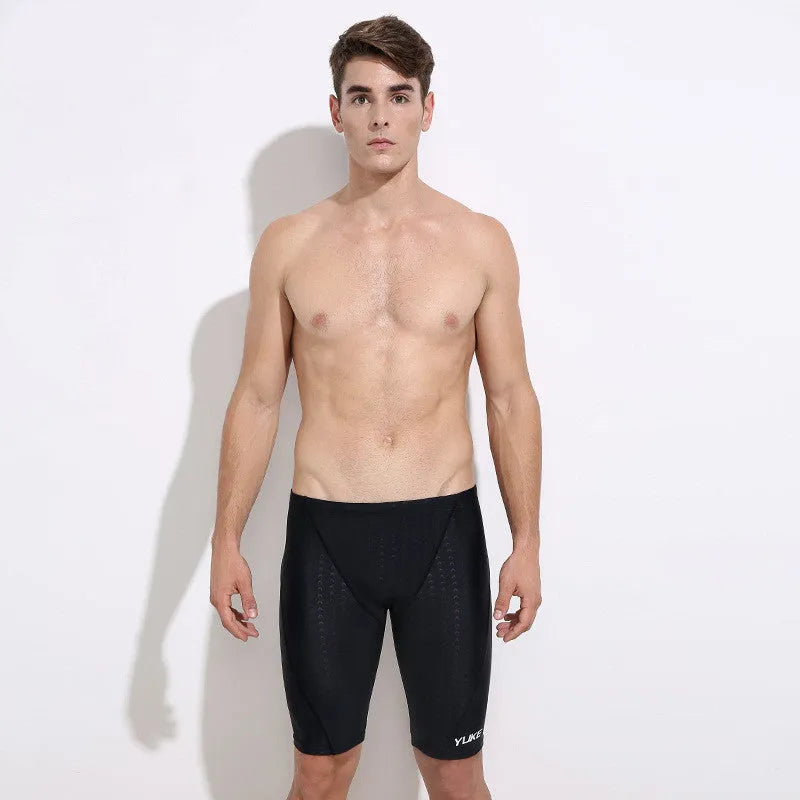 Men's five-piece swimming set showing black trunks, goggles, cap, ear plugs, nose clip, and carry bag.