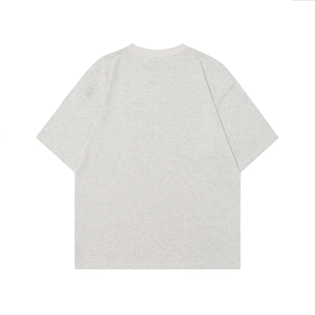Men's black and grey loose fit cotton t-shirt with a retro character design print on the front.