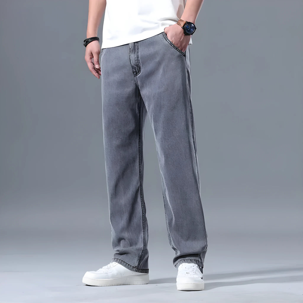 Men's loose straight-leg lyocell jeans in light blue with zipper fly closure