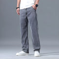 Men's loose straight-leg lyocell jeans in light blue with zipper fly closure