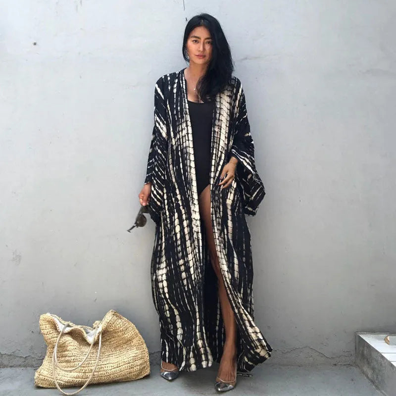 Loose-fitting cotton beach cover-up blouse in a printed pattern, shown in a rust red colour.
