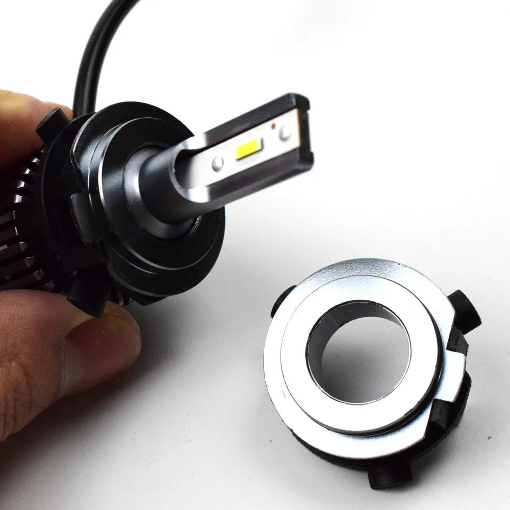 Black ABS plastic LED headlight shaped card holder for car dashboard.