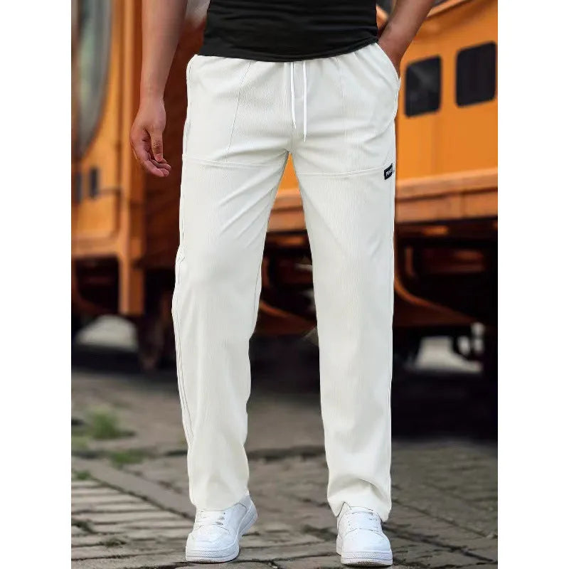 Men's lightweight polyester casual trousers in light grey colour shown flat