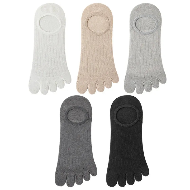 Pair of solid colour modal five-finger boat socks laid flat.