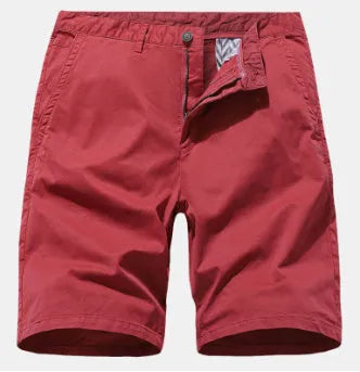 Man wearing loose-fit blue denim casual shorts with no belt, showcasing straight leg design.