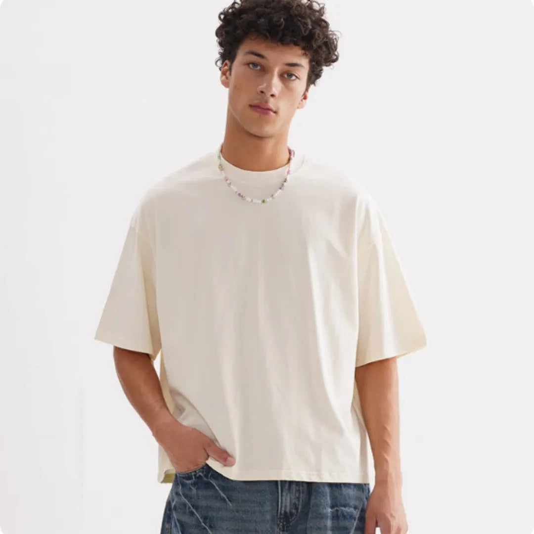 Men's loose fit pure cotton T-shirt in apricot colour on a hanger
