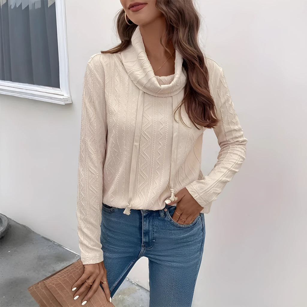 Apricot coloured hooded pullover sweater with drawstring and long sleeves laid flat