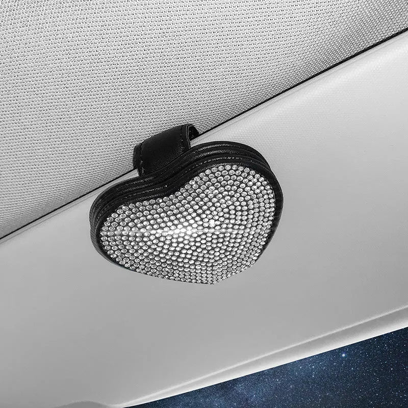 Black diamond-encrusted PU leather magnetic storage clip for car sun visor, holding sunglasses.
