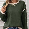 Women's loose knit top with four leaf clover pattern, drop shoulders and contrast colour trim