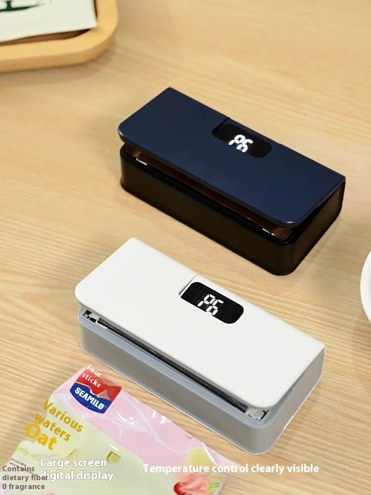 Small white portable heat sealing machine for plastic food bags with hand-press mechanism