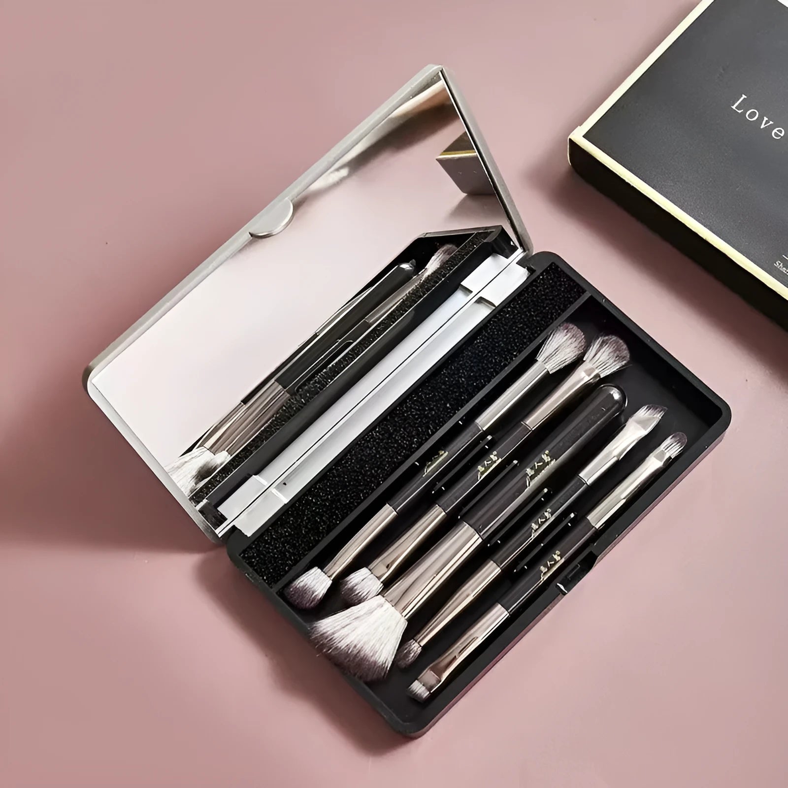 Portable makeup brush set with mirror showing eyeshadow brushes with artificial fibre bristles