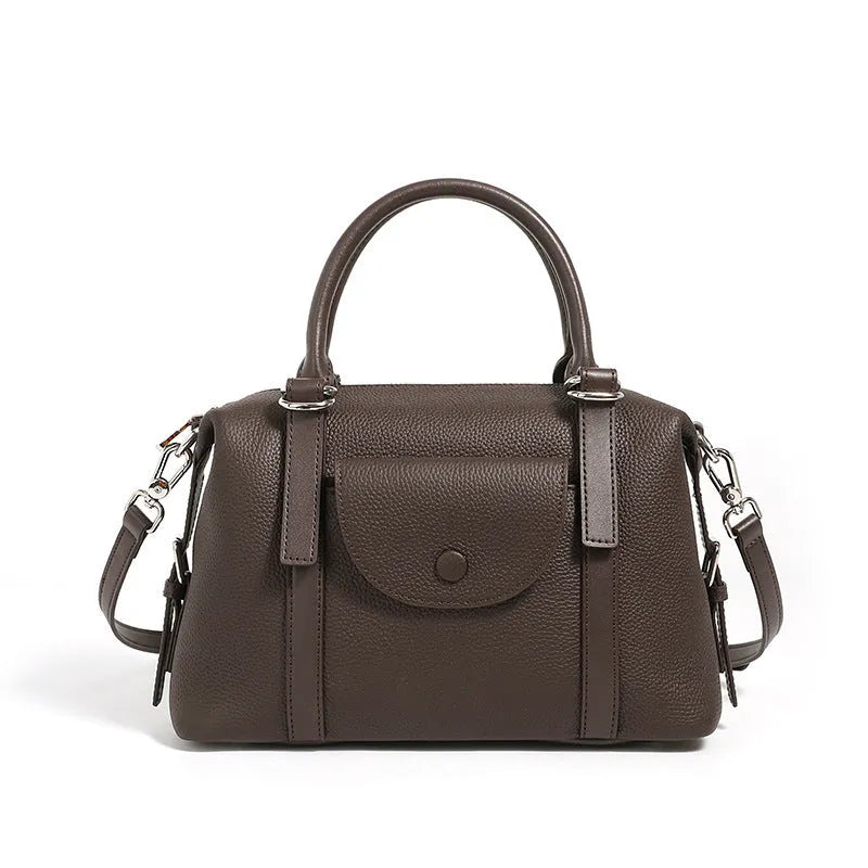 Genuine leather ladies handbag with contrast stitching and lock detail in street style