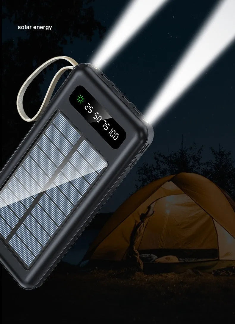 Black and white solar power bank showing its built-in solar panel and USB port.