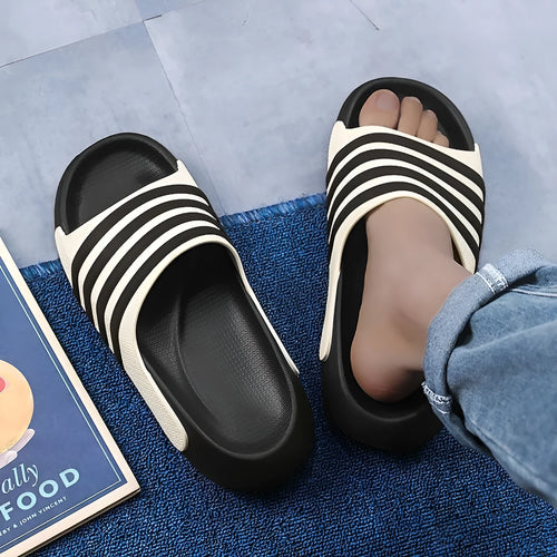 Casual unisex slip-on slippers with PVC upper and EVA sole for outdoor leisure wear.