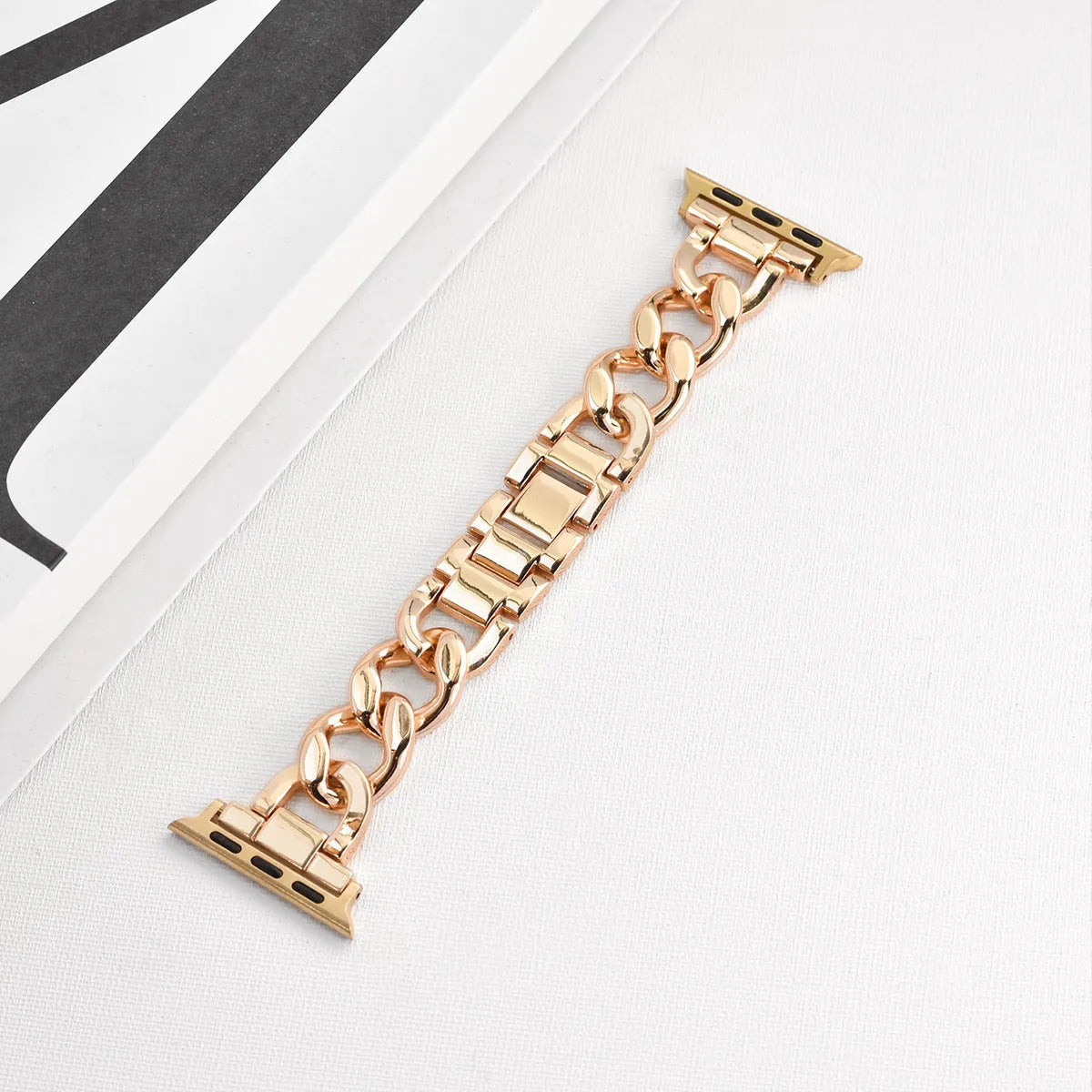 Denim chain link metal Apple Watch replacement strap in silver, black, gold, rose gold, and Starlight colours.