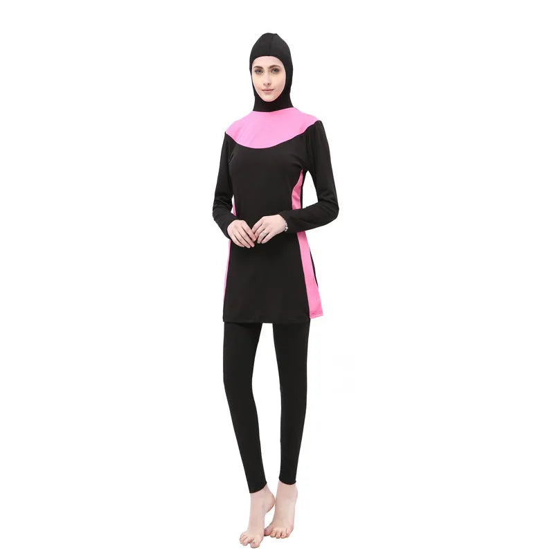 Conservative women's long sleeve swimsuit with hood in black and rose red, showing separate top and trousers.