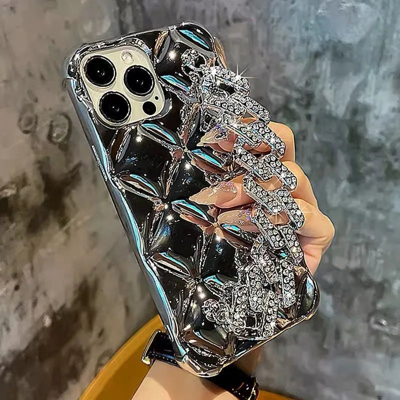 Silver and gold luxury diamond bracelet iPhone cases with chain strap and lock charm for various models.