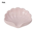 White or pink plastic shell-shaped soap dish for bathroom sink storage