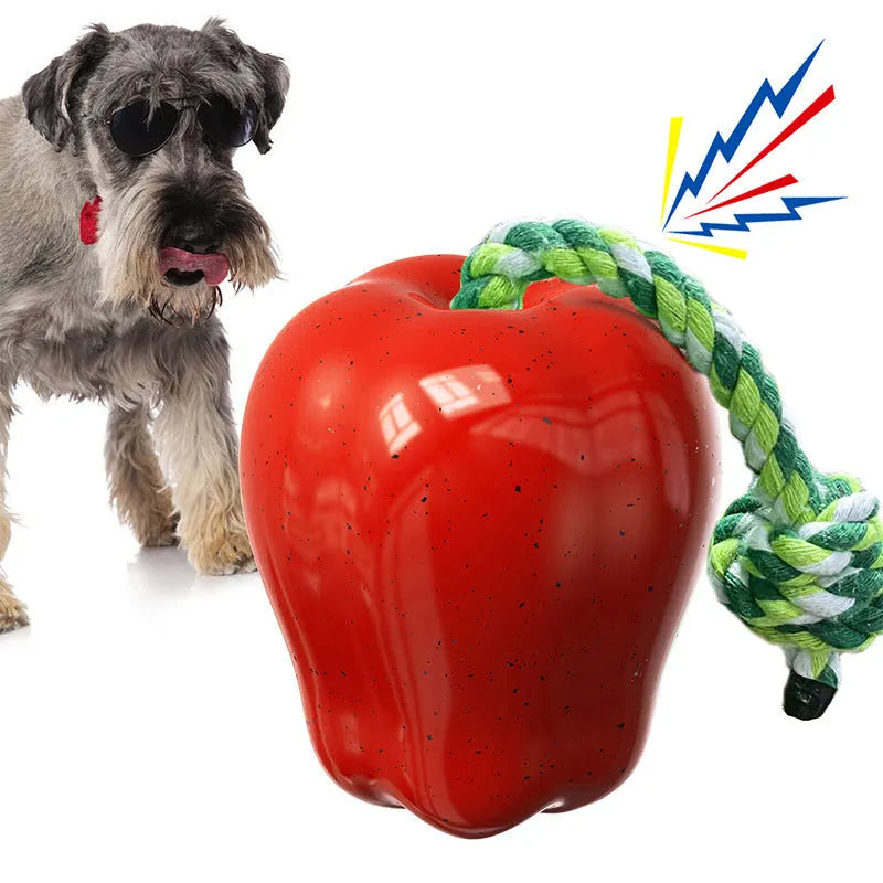 Green plastic Apple-shaped dog chew toy with hollow centre for food dispensing