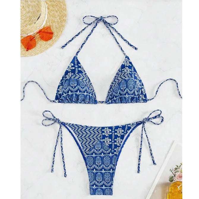 Women's green bandage style bikini swimsuit with split stitching detail on polyester fabric.