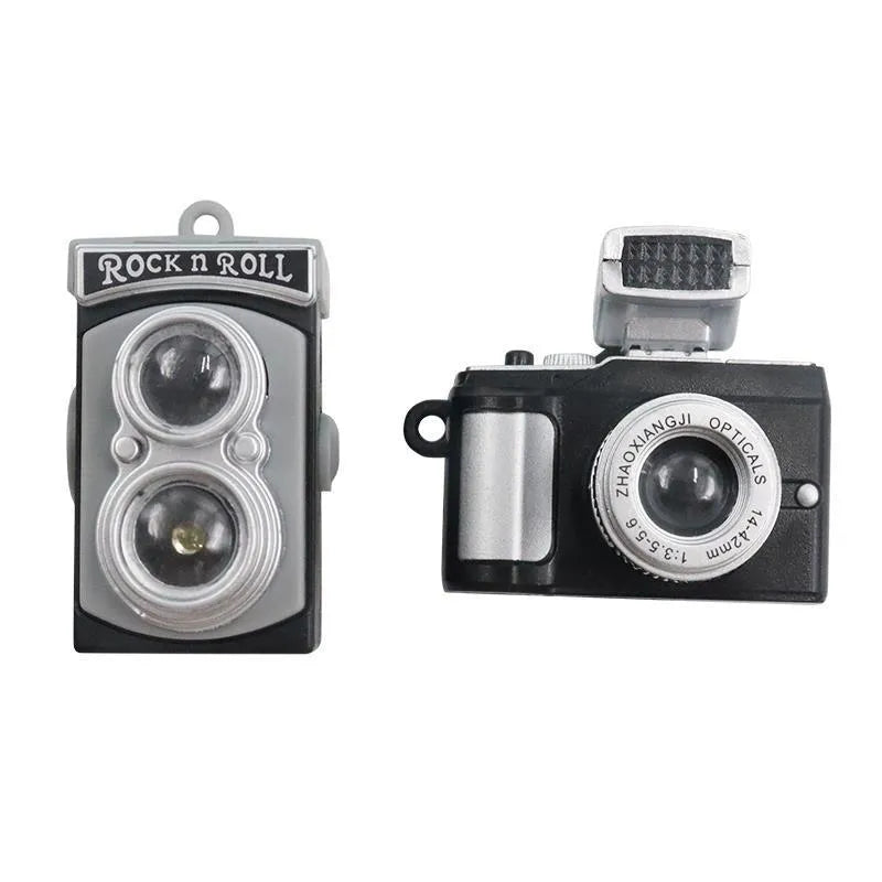 Set of four retro camera dot design plastic adhesive hooks for car dashboard organisation.