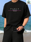 Heavyweight men's short-sleeve t-shirt with large letter print in apricot colour, showing loose fit.