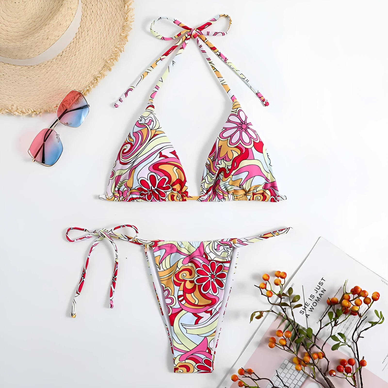 Multicolour printed women's triangle bikini set with hanging neck top and separate bottoms.