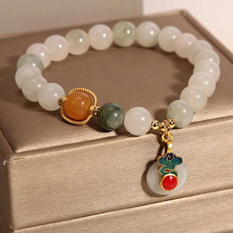 Women's ice jade and pearl bracelet with a retro-styled peace jade buckle.