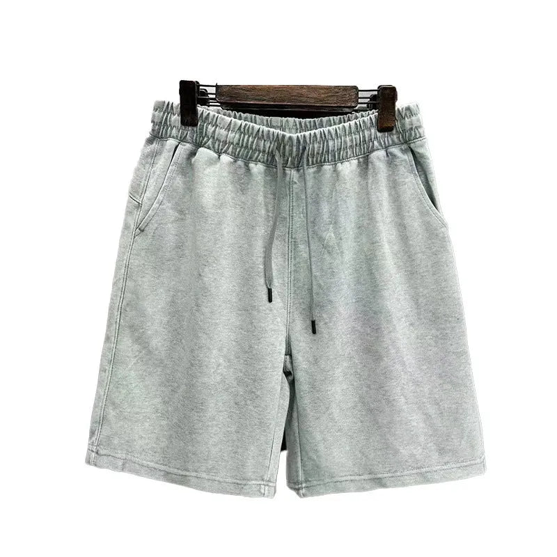 Men's cotton casual shorts with distressed detailing in straight-leg loose fit