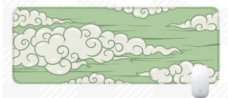 Large cloud pattern rubber desk mat with non-slip base on wooden desk surface