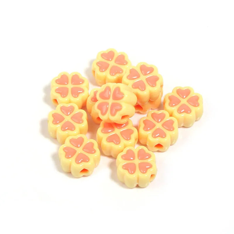 Acrylic four-leaf clover beads with frosted finish in mixed cartoon colours