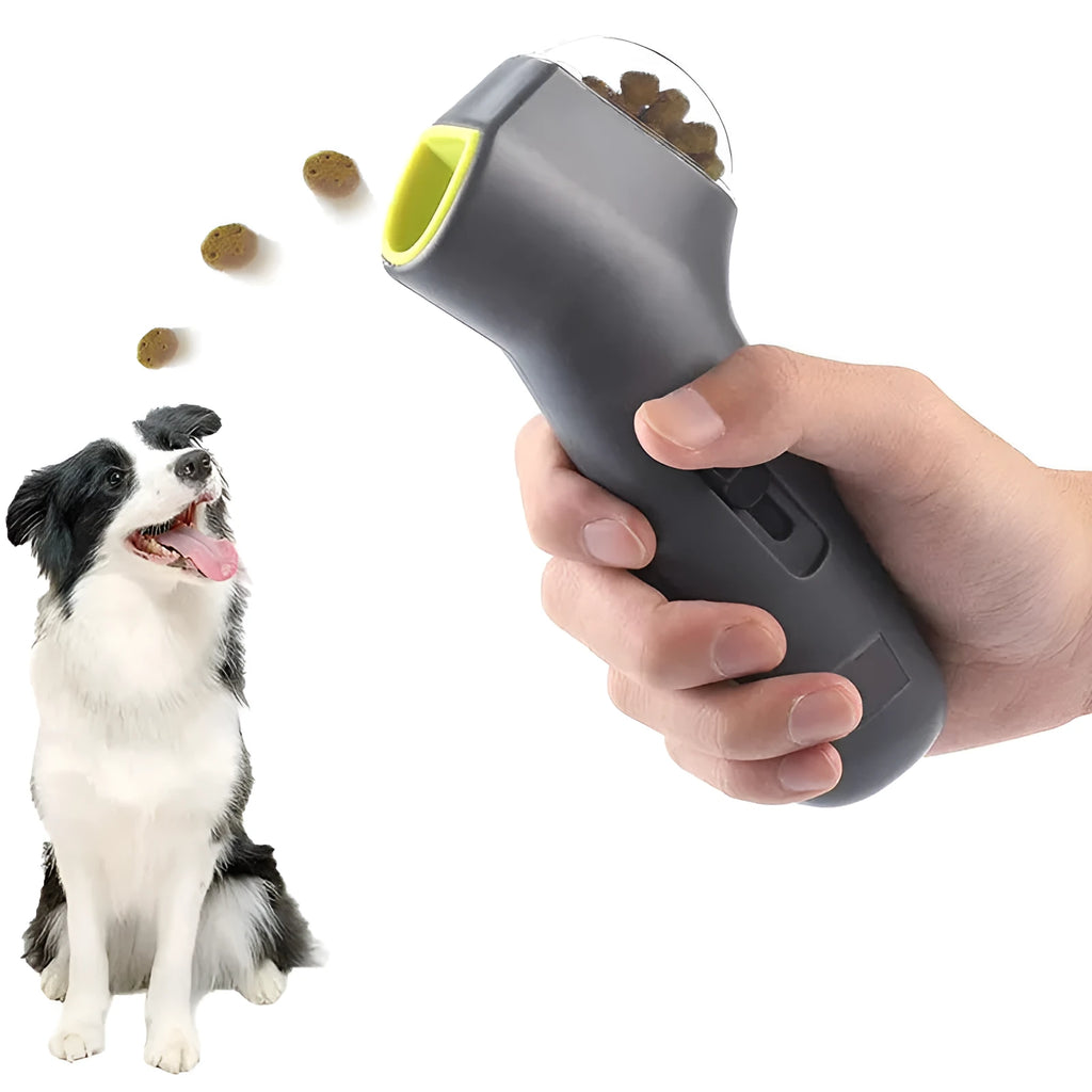 Grey plastic pet snack catapult launcher toy on a plain background.