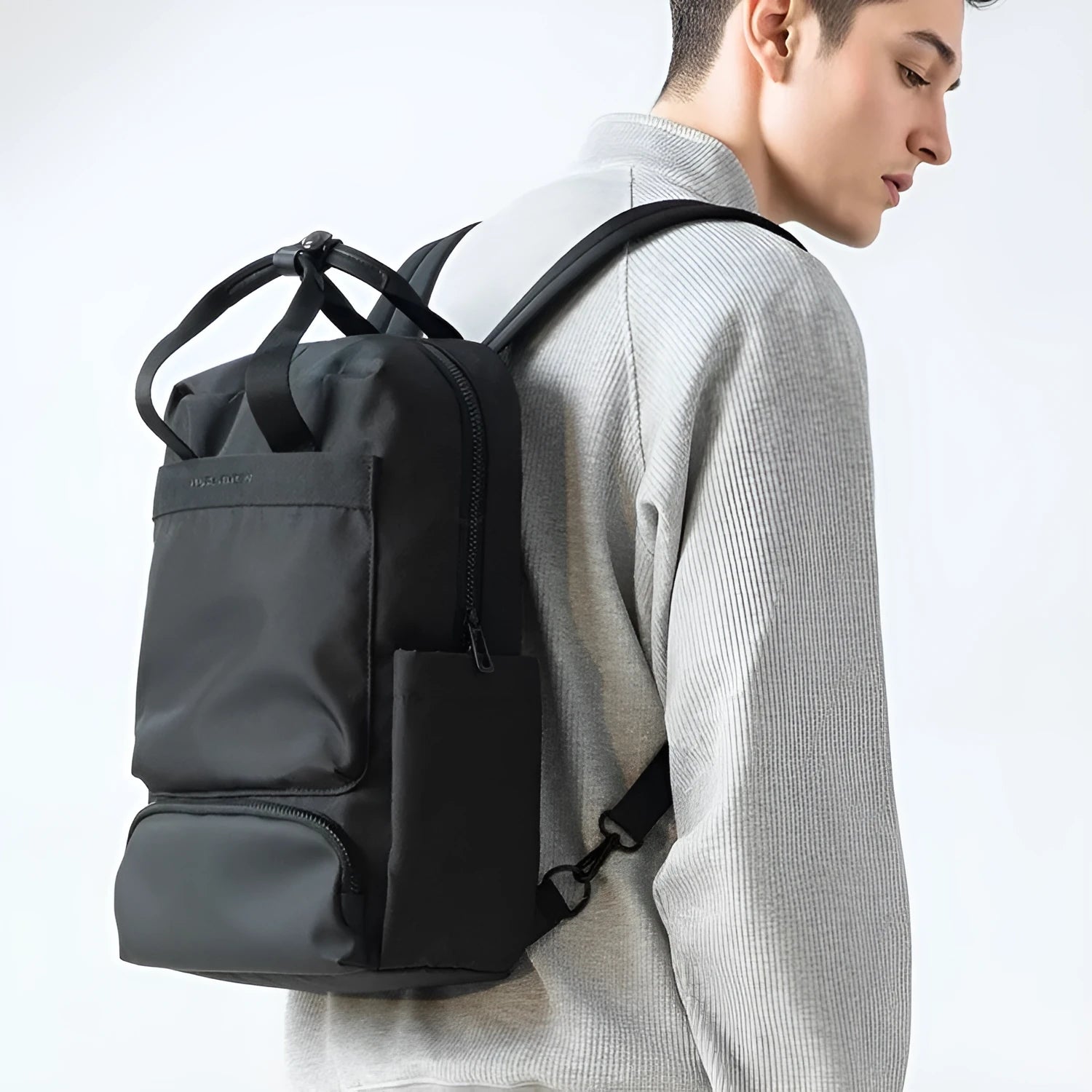 Elegant black computer backpack with 20-35L capacity and multiple storage compartments