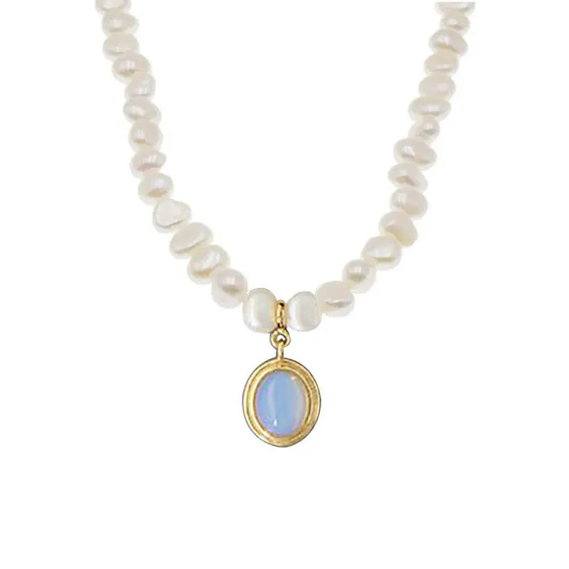 White geometric pendant on an adjustable sterling silver necklace chain.