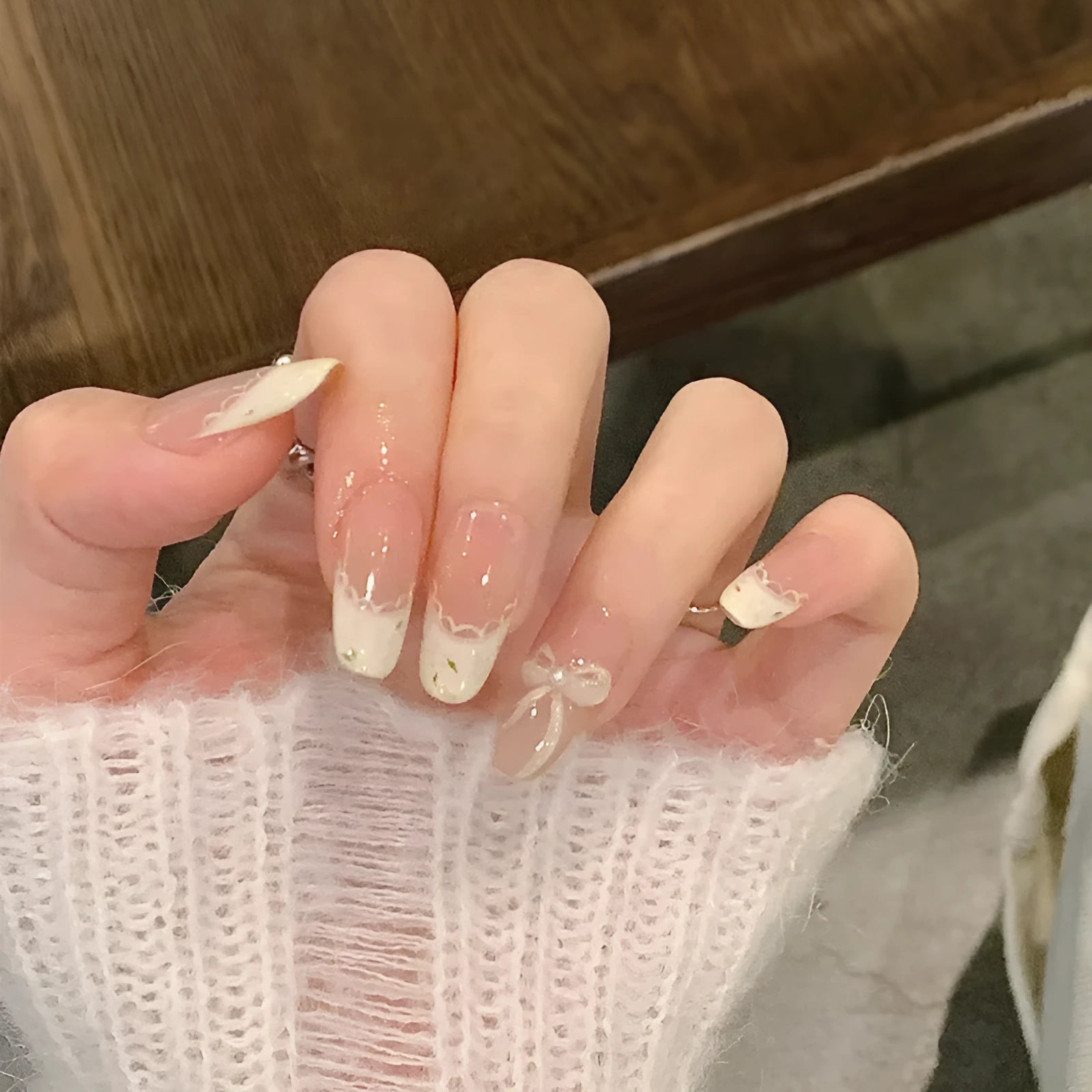 False nails sets for girls showing floral and glitter designs on short oval and stiletto nail shapes