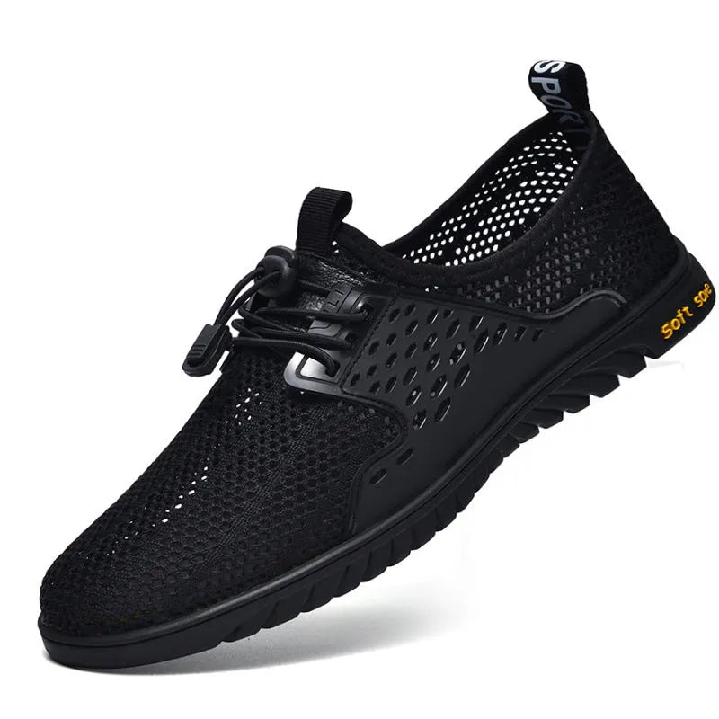 Men's black breathable mesh casual shoes with elastic band fastening and flat rubber sole