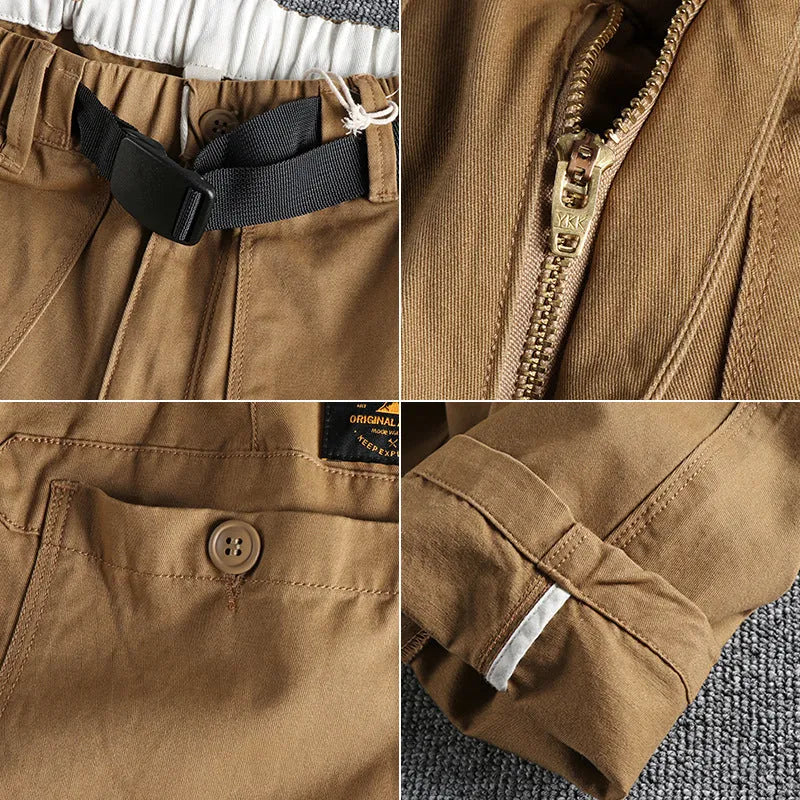Men's khaki cotton work trousers with N I buckle belt showing three-dimensional cutting and mid waist design