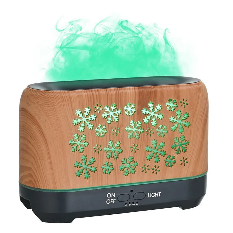 Christmas snowflake pattern humidifier with colourful flame effects and remote control on wooden desk