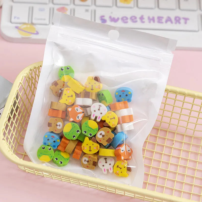 50 colourful cartoon mini erasers in shapes of fruits, animals, and cakes, displayed next to a pearlescent film bag.