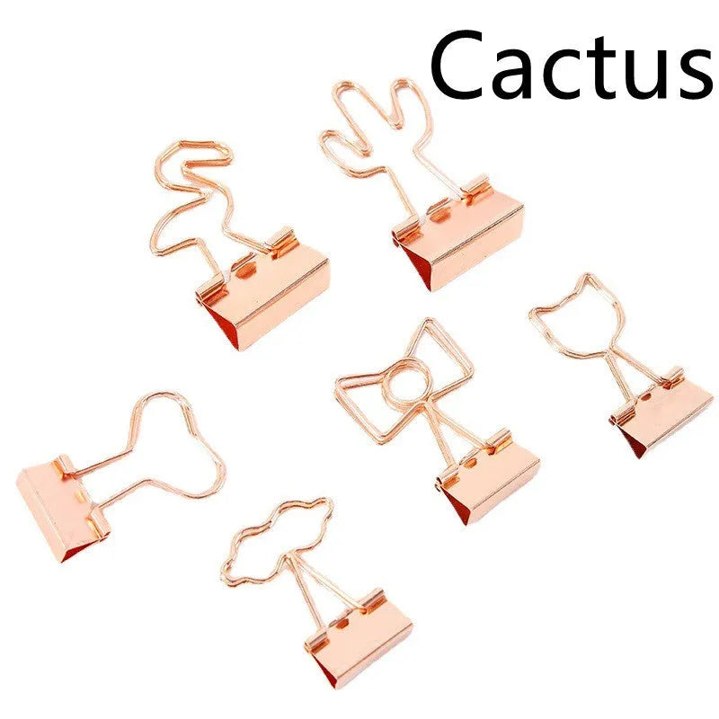 Gold-plated long-tail metal clip with a choice of bow, cactus, cat, flamingo, love, or cloud decorative design.