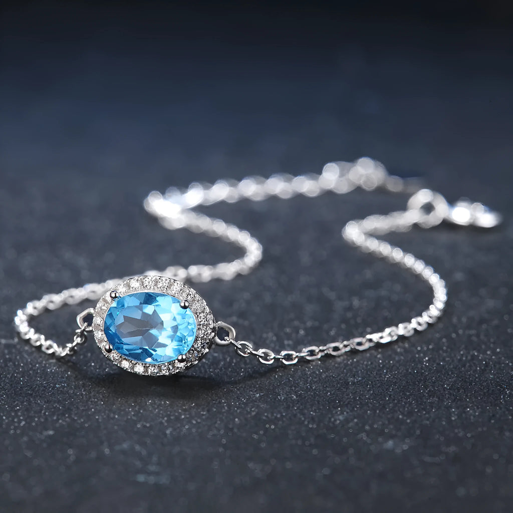 925 sterling silver jewellery set with blue topaz gems including earrings, ring, necklace and pendant