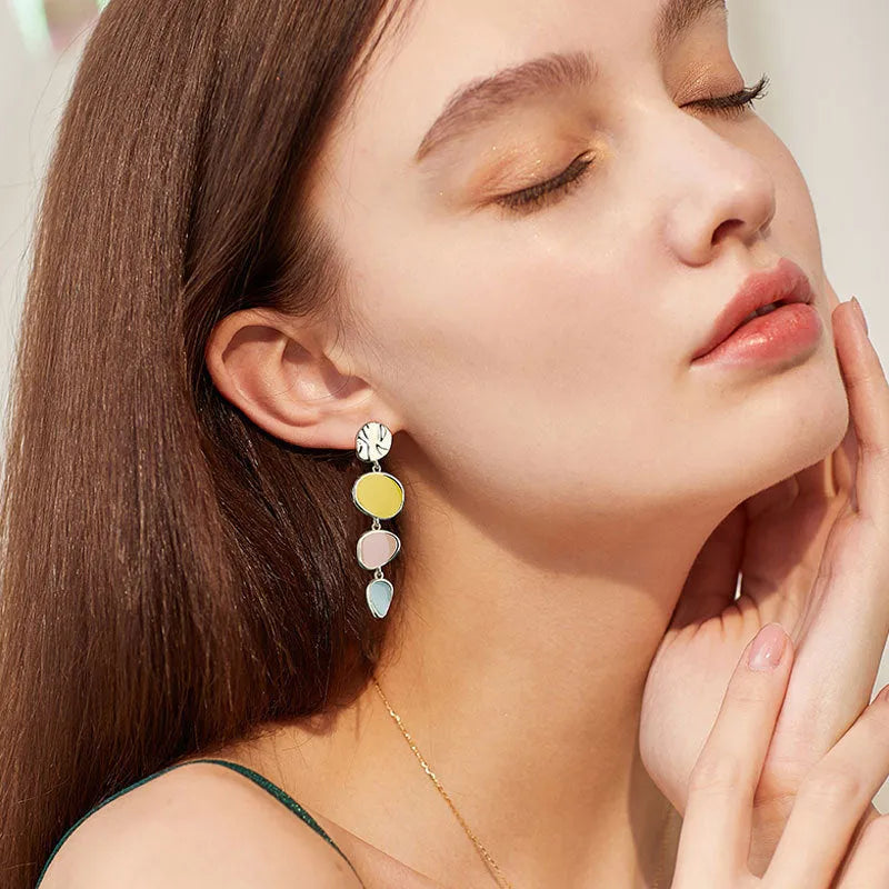 Morandi three-colour oil drip finish on disc-shaped alloy earrings with sterling silver posts.